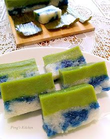 four pieces of green and blue cake on a white plate