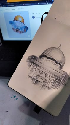 a drawing of a dome on top of a building next to a laptop computer screen