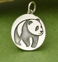 Panda Bear - Sterling Silver Panda Charm - Animal Pendants, Symbolic Charm, Friendship, Peace, Vacation, Travel, Pandas, Wild Life, Beauty. The panda bear is a universal symbol of carefree living. The panda bears hurries for nothing and is a symbol of friendship and peace. It has an important place in Chinese culture and it often compared to the Yin and Yang because of its black and white markings. Length measurement includes the 5mm soldered jump ring. Measurements: H: 1.0 L: 20.0 W: 14.5mm Chinese Panda, Panda Charm, Panda Panda, Tiny Cats, Friendship Symbols, Panda Bears, Sterling Silver Cat, Yin And Yang, Bronze Jewelry