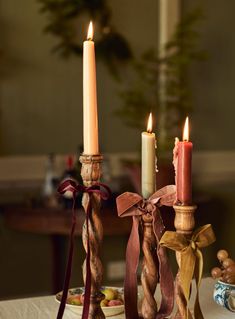 three candles are sitting on a table