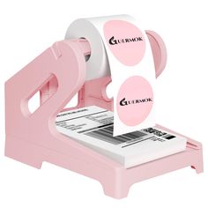 a pink paper dispenser with two rolls of toilet paper