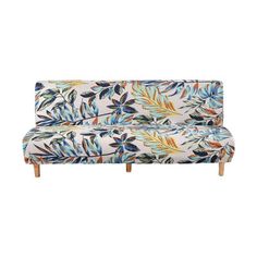 an upholstered couch with colorful leaves on it