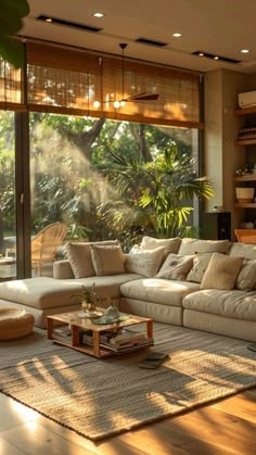 a living room filled with lots of furniture next to a large open window covered in plants