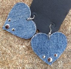 two heart shaped denim earrings with metal studs