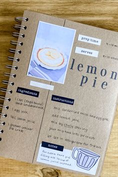 a recipe book on a wooden table with an image of lemon pie in the cover