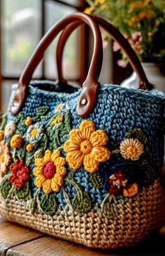 a handbag with flowers on it sitting on a table