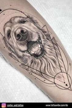 a black and white tattoo with a dog's face on the right arm, in geometric shapes