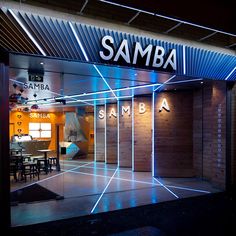 the entrance to samba is lit up at night