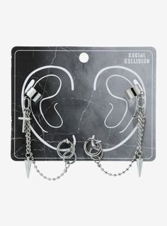 Stay lookin' sharp with this pair of earrings! They feature huggie hoops with ball chains attached  with spike and cross charms hanging from the matching silver-tone cuffs. Edgy Silver Metal Piercings, Goth Accessories Jewellery, Grunge Chains, Alt Earrings, Emo Earrings, Emo Jewelry, Hello Kitty Room Decor, Alt Clothing, Hello Kitty House