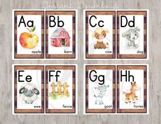 four cards with animals and letters in them on a wooden background, including the letter e