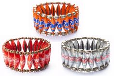 four bracelets with coca - cola cans in the middle and one on each side