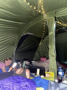 some people are sleeping in a tent with lights