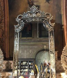 a large ornate mirror in the middle of a room