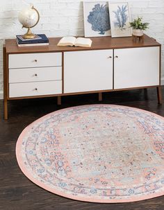 a round rug sits on top of a wooden table