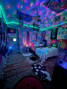 a bedroom decorated in bright colors with lights on the ceiling