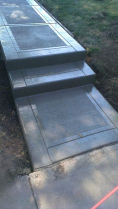 concrete steps leading up to a grassy area