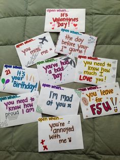 several handmade birthday cards on a bed