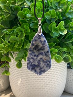 "Natural Blue Sodalite Pendant Necklace Shield Shaped  Size: 50x28x7mm Includes the silver pinch bail and the black leather cord that measures 17 inches long with an extra 2 inches for adjustability Called the blue \"Logic Stone,\" Sodalite emits an easy, tranquil energy that clears the mind and elicits deep thought, expanding the ability to arrive at logical conclusions based on rational consideration. It enhances one's powers of analysis, intuition, observation and creativity, and strengthens self-discipline, efficiency and organization. Sodalite does not stimulate wisdom, but rather clears one's vision and intellect opening the mind to formulate wisdom Since natural stones/gemstones are created in nature, they will often have minor flaws, imperfections or inclusions that have occurred o Memory Wire Wrap Bracelets, Jasper Earrings, Blue Sodalite, Moon Pendant Necklace, Wire Wrapped Bracelet, Deep Thought, Dendritic Agate, Memory Wire, Moon Pendant