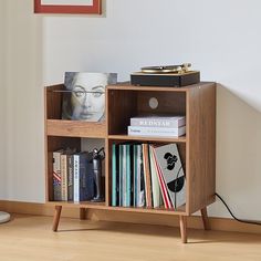 a book shelf with books and magazines on it