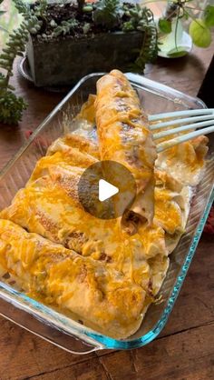 a glass casserole dish filled with cheese and meat