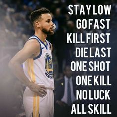 a man standing in front of a crowd wearing a white and blue uniform with the words stay low go fast kill first