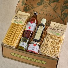 an open box filled with pasta and condiments