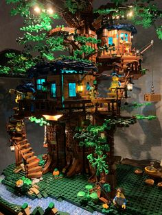 a tree house made out of legos on display