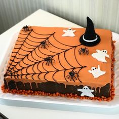 a cake decorated with icing and spooky decorations