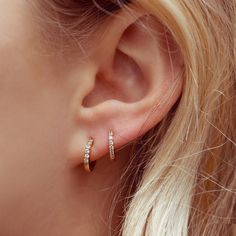 Let's be clear, these Clear Cubic Mini Hoops are to die for! Tag @shopgirlscrew and #girlscrewbabes to show us how you rock these mini treasures. 18k gold plated, 18k rose gold plated, or rhodium plated over brass Cubic zirconia stones 12mm hoop diamater Available in other stone colors Want to know how to take care of Ear Piercings Inspiration Simple, Second Stud, 2nd Piercing, Minimal Hoop Earrings, Arabic Jewelry, Pretty Ear Piercings