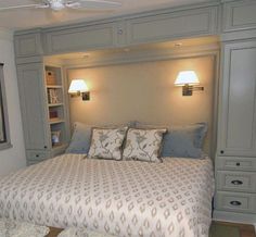 a large bed sitting in a bedroom next to two lamps