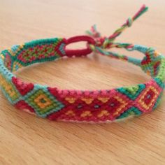 a close up of a bracelet on a table