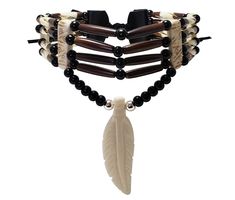 - This choker is made from authentic buffalo bone feather pendant, buffalo bone hairpipe beads, genuine leather, 6mm round metal beads, and 6mm round black synthetic beads. - The neckline is 13.5 inches long (without the leather ties). - The pendant is hand carved from authentic buffalo bone. - This is a traditional 4 strand tribal bone choker. - This jewelry is 100% handmade in the USA. We accept custom orders, just message us to discuss your ideas. Peter Quill, Bone Jewelry, Feather Pendant, Bone Beads, Jewelry Fashion Trends, Black Feathers, Fantasy Jewelry, Metal Beads, Bones