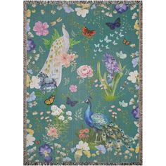 a tapestry with flowers, butterflies and peacocks on the ground in front of a blue background