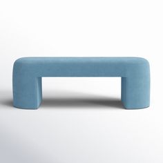 a blue bench sitting on top of a white floor