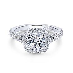 a diamond engagement ring with two halos on top