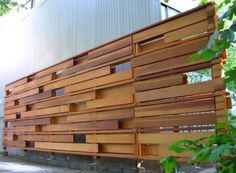 a large wooden structure sitting on the side of a road