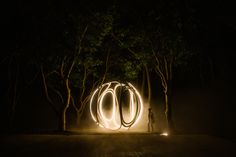 a person standing in front of a light painting