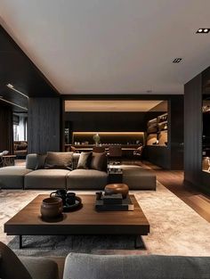 a living room with couches and tables in it