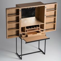 a wooden desk with drawers and shelves on it