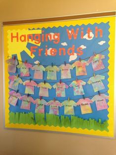 a bulletin board with clothes hanging from it's sides and the words hanging with friends written on them