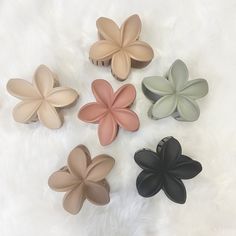 "The cutest aesthetic matte color hawaiian flower hair claw clip that pairs perfectly with any outfit! The hawaiian flower hair claw clip is a great accessory for yourself or a gift for your bestie! Put your hair up or down with this trendy Hawaiian flower claw hair clip.  🤍 Size:  - When closed: 3.15\"H x 3.15\"L x 1.58\"W - When open width is 3.15\"   🤍 How to order:  1.) Select the color hair claw clip of your choice.  2.) Add to cart 3.) Checkout 🤍 Product details: - Hawaiian flower design - Matte color - Anti slip claw teeth design - Powerful metal spring & easy to open 🤍 More items you'll love: ◻️ Engraved flower Stanley tumbler 40oz: https://www.etsy.com/listing/1569362735 ◻️ Evil Eye Daisy Charm: https://www.etsy.com/listing/1595181427 ◻️Wildflower Apple Watch Band: https://www Hair Clip Updo, Hawaiian Flower Design, Clip Updo, Hawaiian Flower Hair, Flower Hair Claw, Claw Hair Clip, Hair Up Or Down, Aesthetic Gift, Daisy Charm