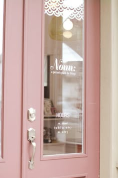 a pink door with the words mom on it