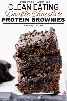 chocolate brownies stacked on top of each other with text overlay that reads clean eating double chocolate protein brownies