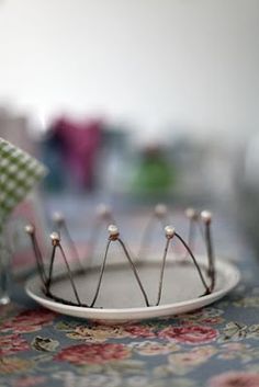 a crown sitting on top of a white plate