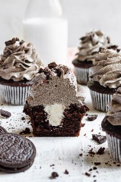 chocolate cupcakes with frosting and oreo cookies