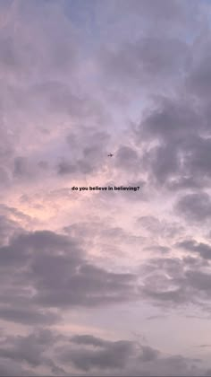 an airplane is flying in the sky with some clouds above it that says do you believe inbetweening?