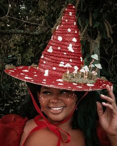 a woman wearing a red and white hat