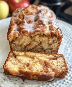 a loaf of cinnamon apple bread sitting on top of a white plate