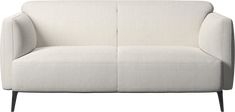 a white couch sitting on top of a wooden frame