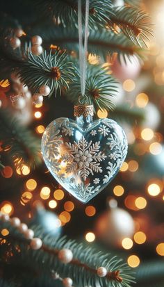 a heart shaped ornament hanging from a christmas tree